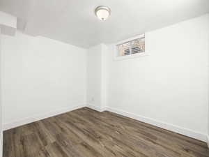 Empty room with wood finished floors and baseboards