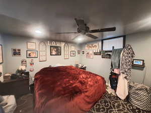 Spacious bedroom with ceiling fan and recessed lighting