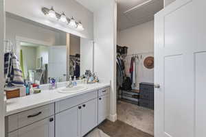 Bathroom featuring vanity and wood finished floors