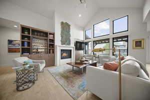 Living room with gas fire place, Built in bookcase and bar