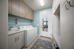 Laundry room/mud room featuring a sink, and Built in closet space with a bench