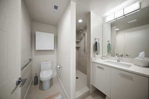 Full bath featuring a tile shower, tile patterned flooring