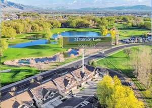 Bird's eye view with a golf course and mountain view