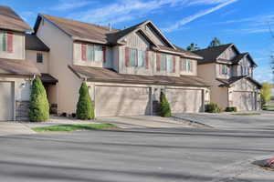 Multi unit property with driveway, and an attached garage