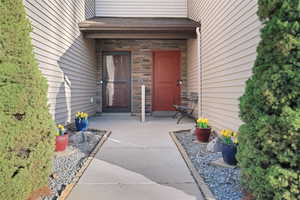 Property entrance with stone siding
