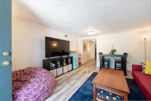 Living room featuring engineered floors.