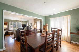 Dining area with recessed can lighting.