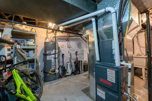 Utility room is off of the kitchen area.  Full sized washer and dryer for the apartment.  Two newer high efficiency furnaces with A/C for each furnace.  Excellent storage.