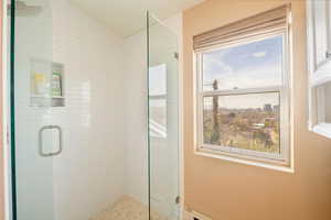 Separate glass and tile shower.
