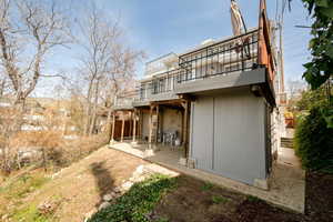 Rear of home showing the second patio and storage shed.