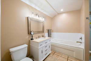 primary full garden tub and new glass and tile shower.
