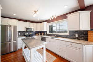Updated kitchen with newer stainless steel appliances.  Rich original fir floors.