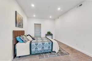 Bedroom with baseboards, carpet, visible vents, and recessed lighting