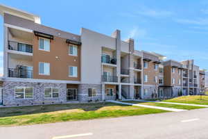 View of property with a residential view