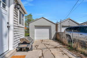 Detached garage with concrete driveway
