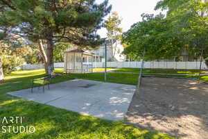 Exterior space featuring a pergola, fence, and a lawn