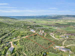 Aerial view with a rural view and a mountain view