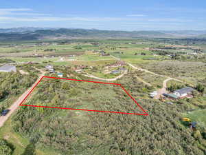 Drone / aerial view featuring a mountain view and a rural view