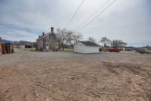 View of yard with an outbuilding and a mountain view