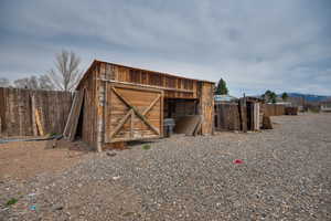 View of outdoor structure featuring an outbuilding