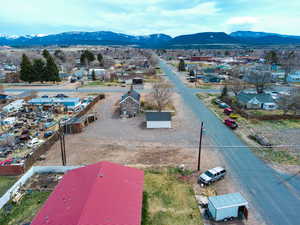 Birds eye view of property with a mountain view