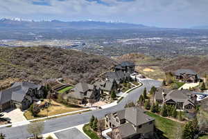 Birds eye view of property with a mountain view and a residential view
