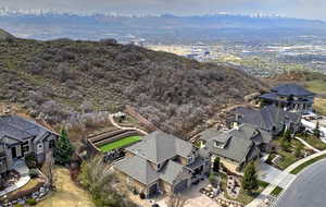 Birds eye view of property featuring a mountain view and a residential view