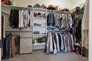Walk in closet featuring carpet floors