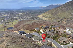 Birds eye view of property with a residential view and a mountain view