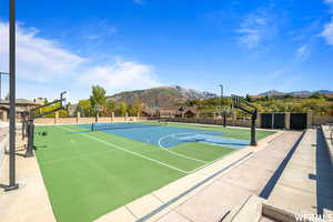 View of sport court with community basketball court and a mountain view