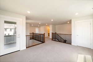 Unfurnished room with baseboards, recessed lighting, and carpet