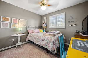 Bedroom with baseboards, ceiling fan, and wood finished floors