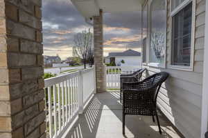 Balcony featuring covered porch