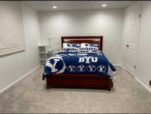 Carpeted bedroom featuring recessed lighting and baseboards