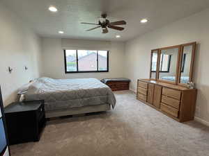Carpeted bedroom with baseboards, recessed lighting, a textured ceiling, and ceiling fan