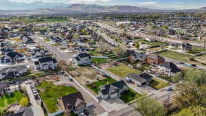 Birds eye view of property featuring a mountain view and a residential view