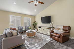 Living area featuring baseboards, recessed lighting, carpet floors, lofted ceiling, and ceiling fan