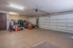 Garage featuring a garage door opener