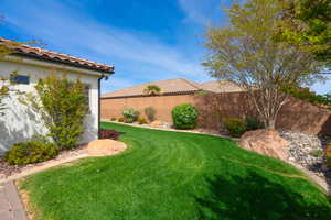 View of yard featuring fence