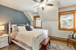Bedroom with wood finished floors and ceiling fan