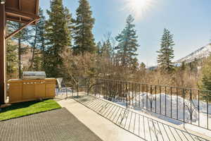 View of patio featuring a balcony