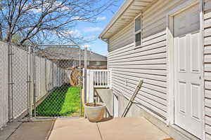 Exterior space featuring fence and a gate
