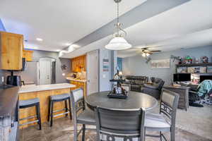 Dining room with ceiling fan and recessed lighting