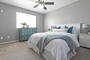 Bedroom featuring baseboards, a ceiling fan, and light carpet