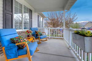 Balcony with a mountain view and covered porch