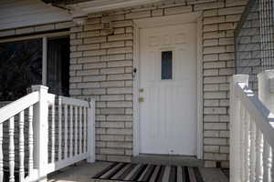Brick with front porch railings