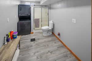 Bath room down with stackable washer/dryer and a shower. Plumbed for a vanity but vanity has not been installed