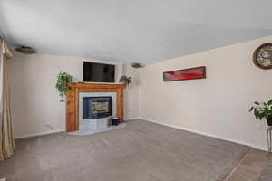 Living Room with wood mantel and pellet stove