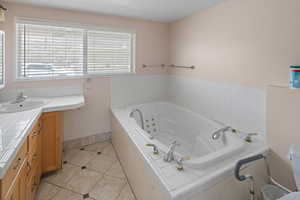 Primary bath with a jetted tub and separate shower.