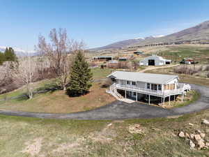 Birds eye view of property featuring views of the valley and the mountains.